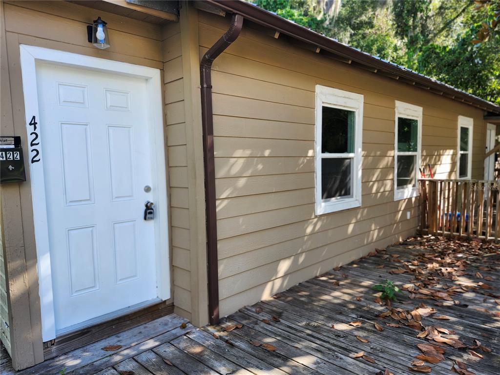 422 Northwest 9th Avenue Gainesville, FL 32601 - Photo 2 of 9 a back view of a house with a door