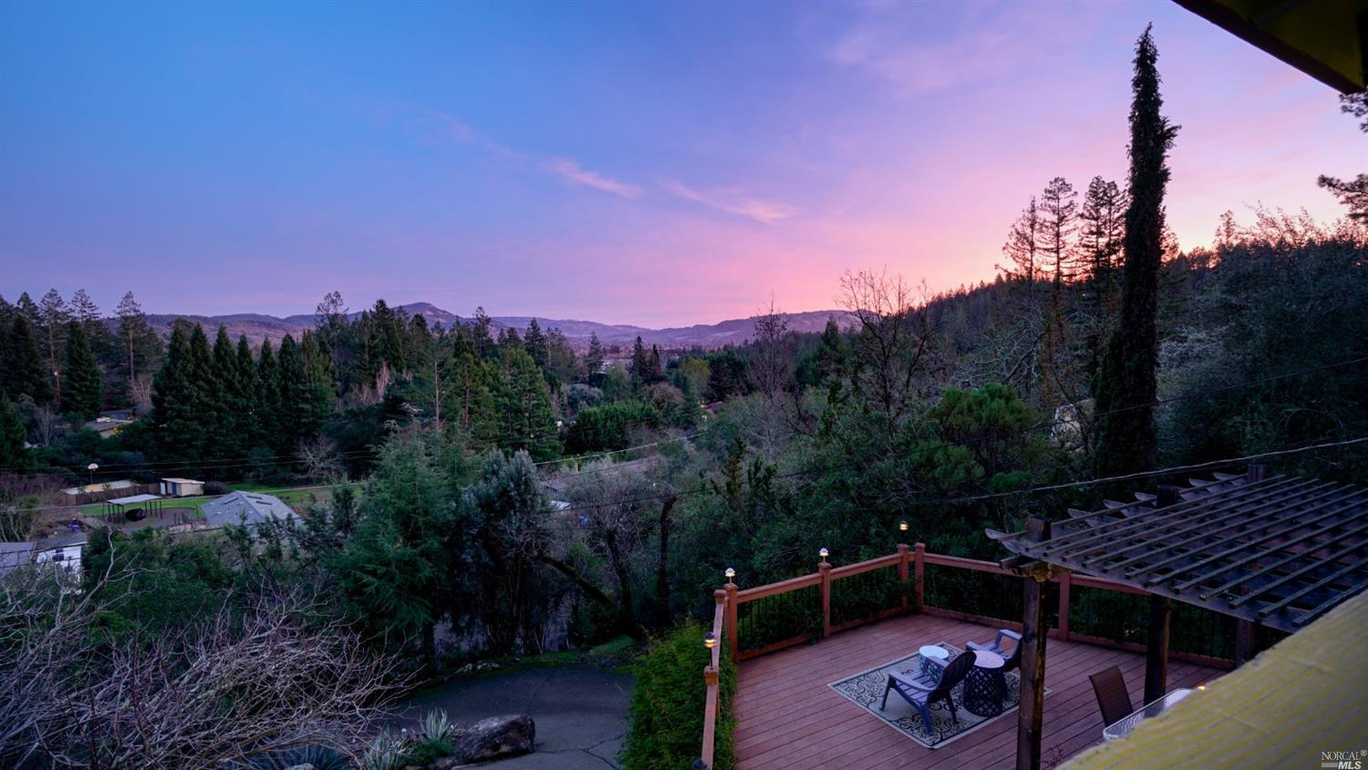 a view of a backyard with mountain view and mountain view