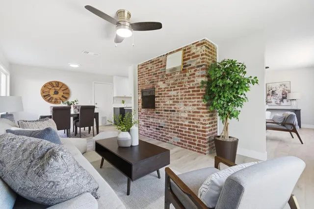 a dining room with furniture and a window
