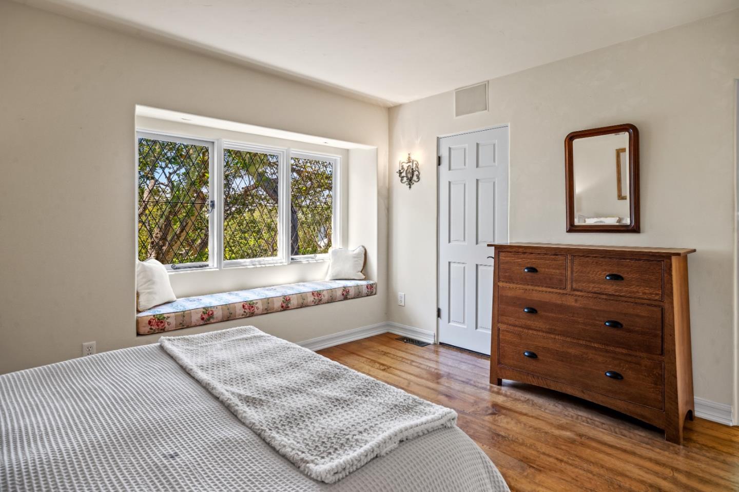 0 Southeast Corner Santa Rita And 6th Carmel, CA 93921 - Photo 18 of 29 a bedroom with a bed and a dresser