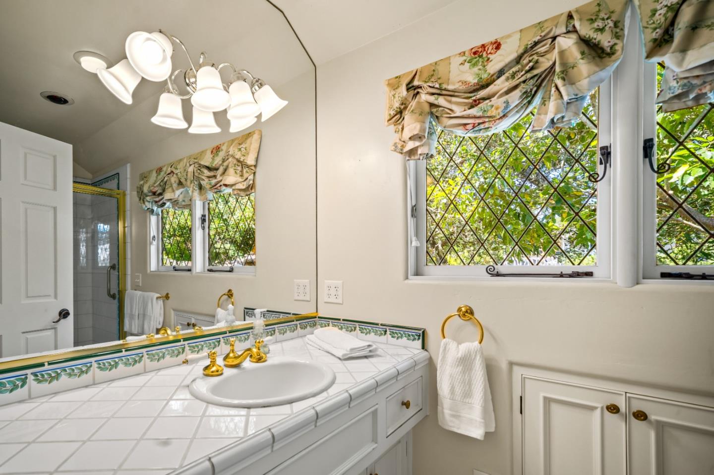 0 Southeast Corner Santa Rita And 6th Carmel, CA 93921 - Photo 19 of 29 a bathroom with a granite countertop sink a large mirror and a window