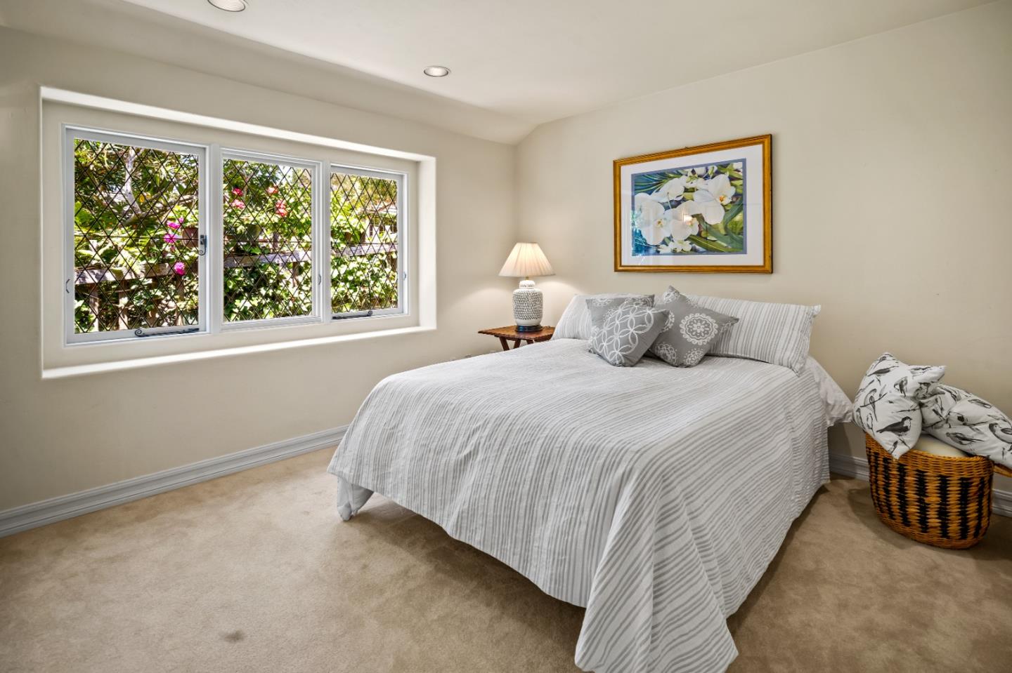 0 Southeast Corner Santa Rita And 6th Carmel, CA 93921 - Photo 21 of 29 a bedroom with a bed and a large window