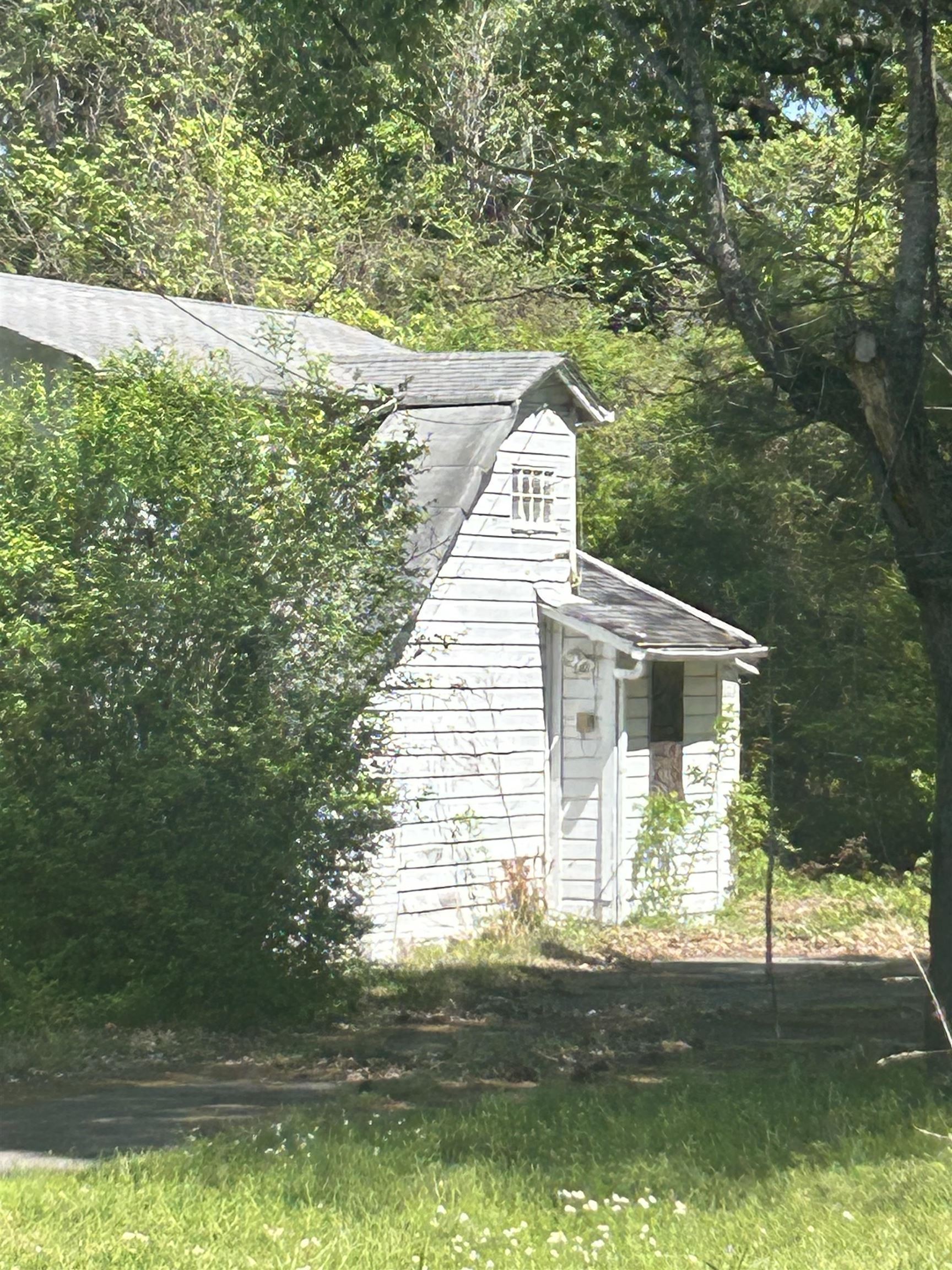 3058 Alta Road Memphis, TN 38109 - Photo 2 of 10 View of outbuilding featuring a wooded view
