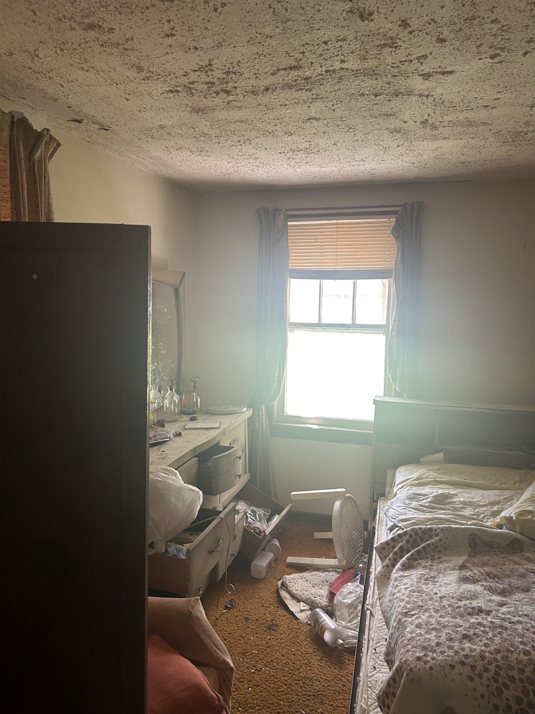 3058 Alta Road Memphis, TN 38109 - Photo 7 of 10 Bedroom featuring dark colored carpet and a textured ceiling