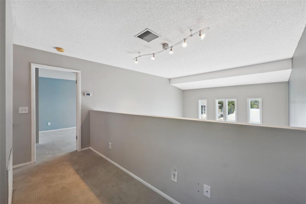 428 West Klosterman Road Palm Harbor, FL 34683 - Photo 18 of 44 wooden floor in an empty room