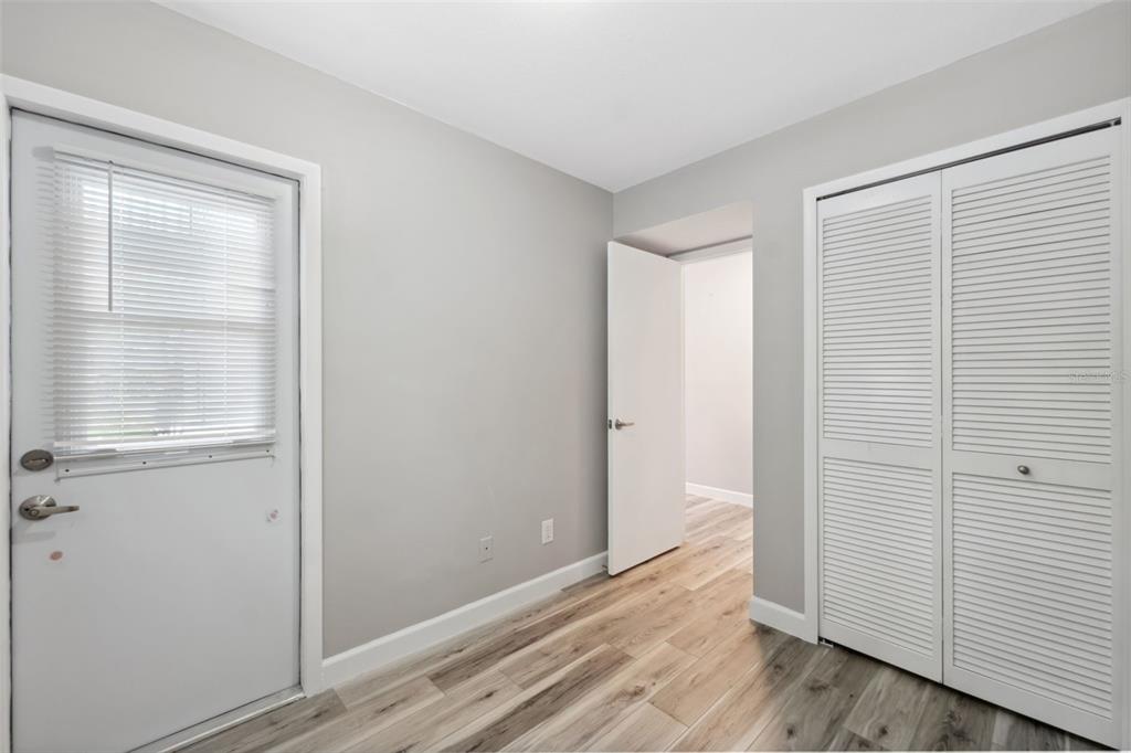 428 West Klosterman Road Palm Harbor, FL 34683 - Photo 21 of 44 a view of an empty room and wooden floor