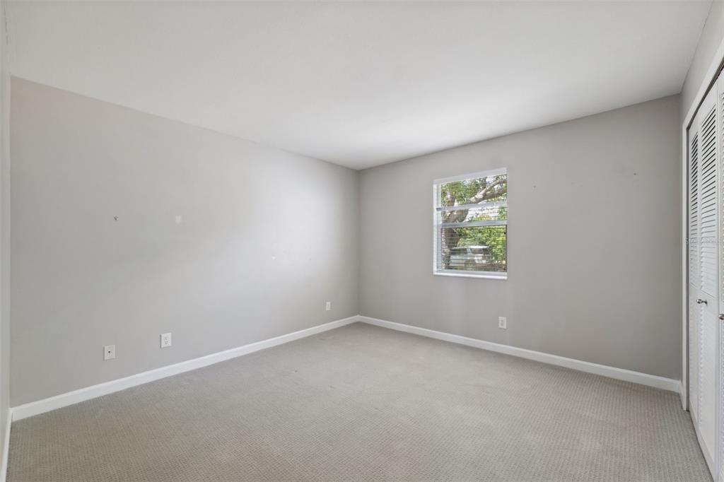 428 West Klosterman Road Palm Harbor, FL 34683 - Photo 22 of 44 an empty room with a window