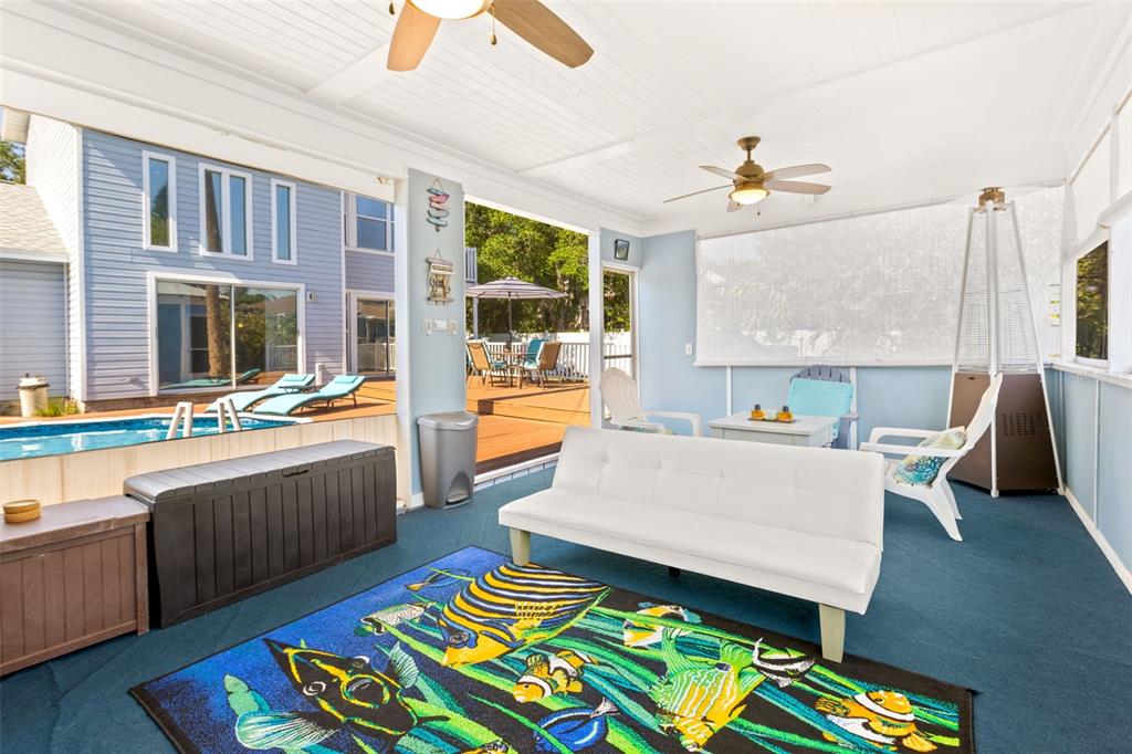 428 West Klosterman Road Palm Harbor, FL 34683 - Photo 36 of 44 a living room with furniture and a table