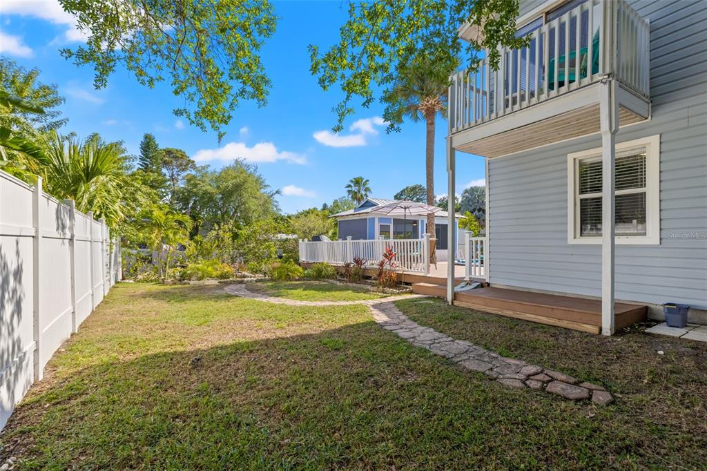 428 West Klosterman Road Palm Harbor, FL 34683 - Photo 38 of 44 a view of a house with backyard and sitting area