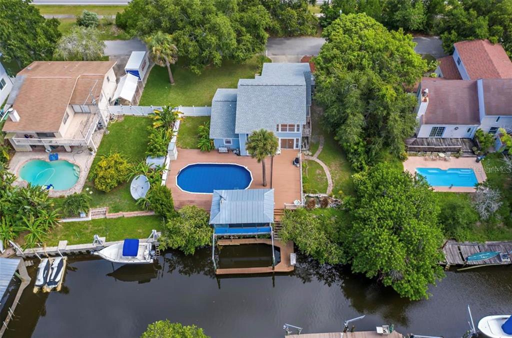 428 West Klosterman Road Palm Harbor, FL 34683 - Photo 39 of 44 an aerial view of a house with garden space and street view