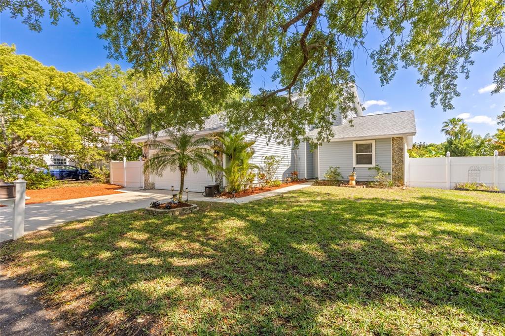 428 West Klosterman Road Palm Harbor, FL 34683 - Photo 43 of 44 a view of backyard of house with green space