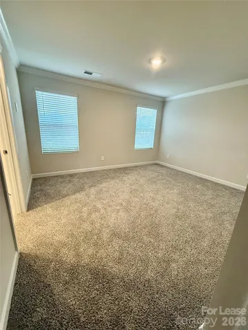 a bathroom with double sink and a mirror