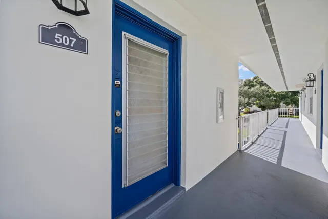 a view of a hallway with wooden walls and stairs