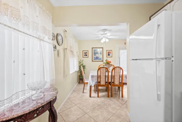 a dining room with furniture and a chandelier