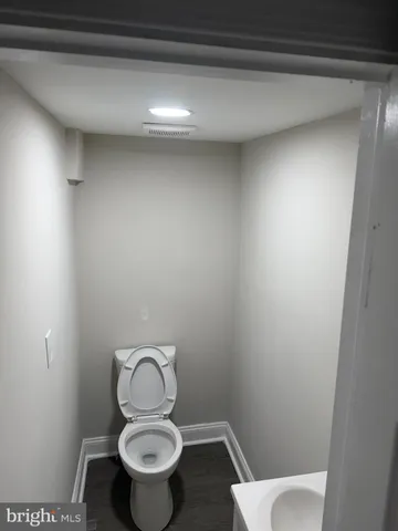 a white toilet sitting in a bathroom