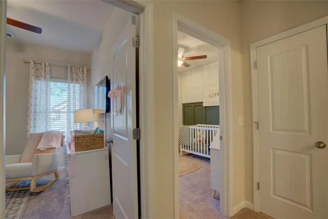 a room that has a couch and a chair with wooden floor