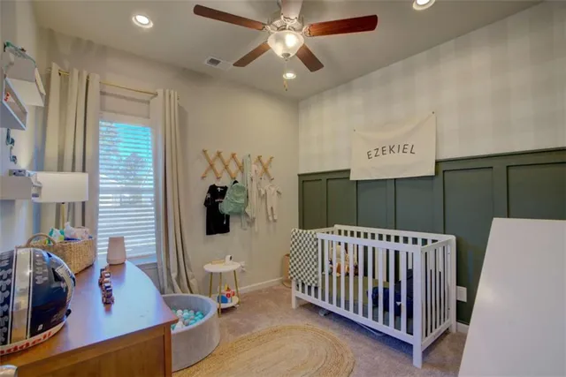 a bedroom with furniture and a window