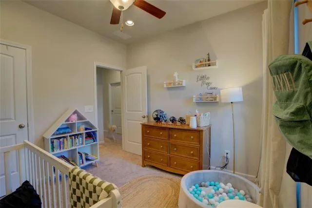 a room with furniture and baby crib