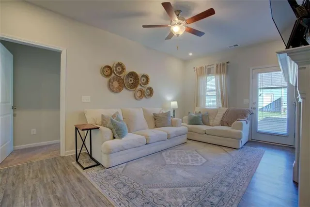 a living room with furniture and a large window