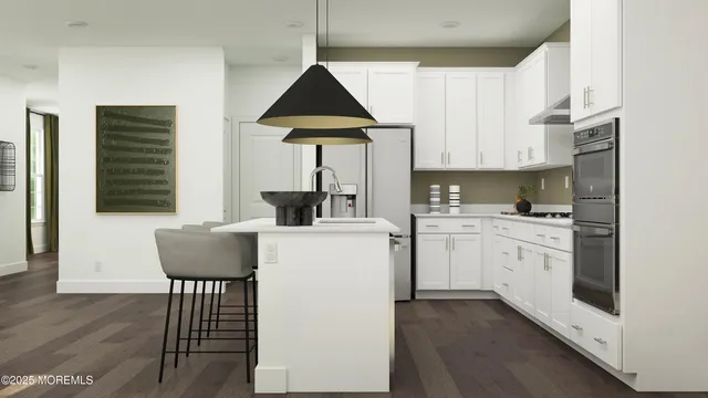 a kitchen with cabinets appliances and a window