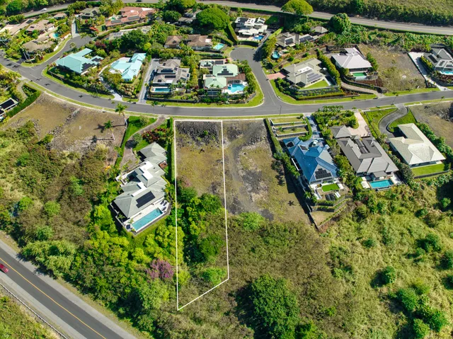 an aerial view of a residential houses with outdoor space