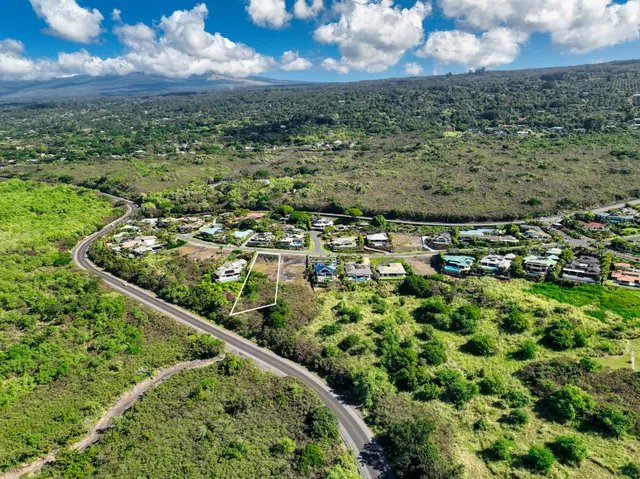 a view of a lake with a yard