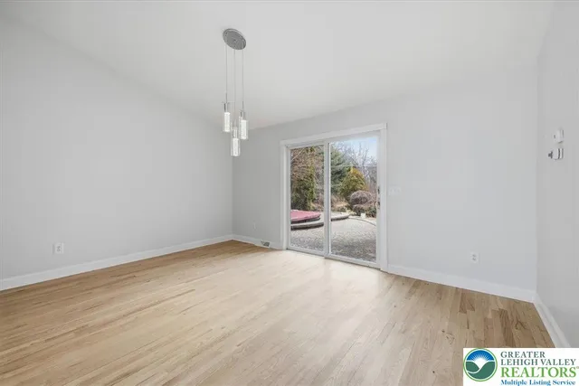 a kitchen with stainless steel appliances kitchen island wooden cabinets and granite counter tops