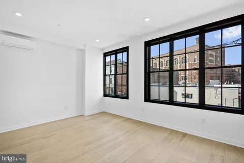 a view of an empty room with a large window