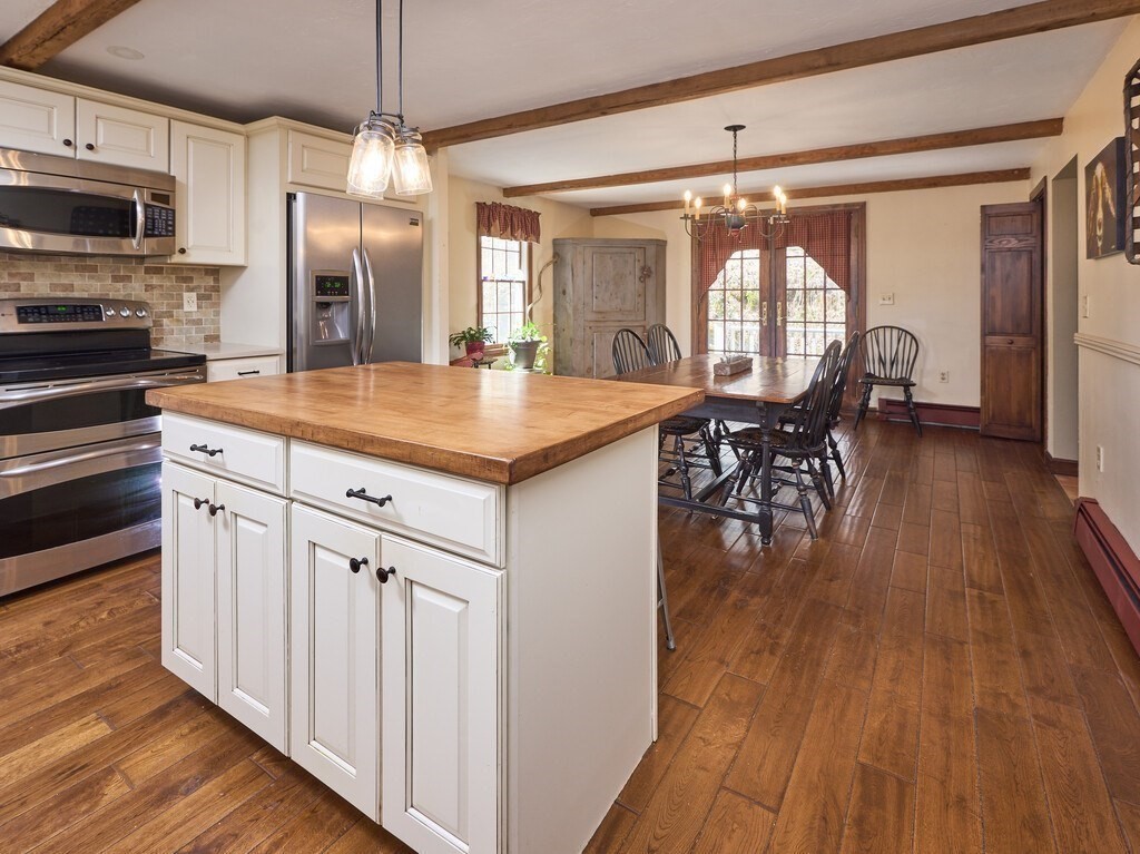 4 Martin Road Brookfield, MA 01506 - Photo 13 of 39 a kitchen with stainless steel appliances granite countertop a kitchen island hardwood floor and a sink