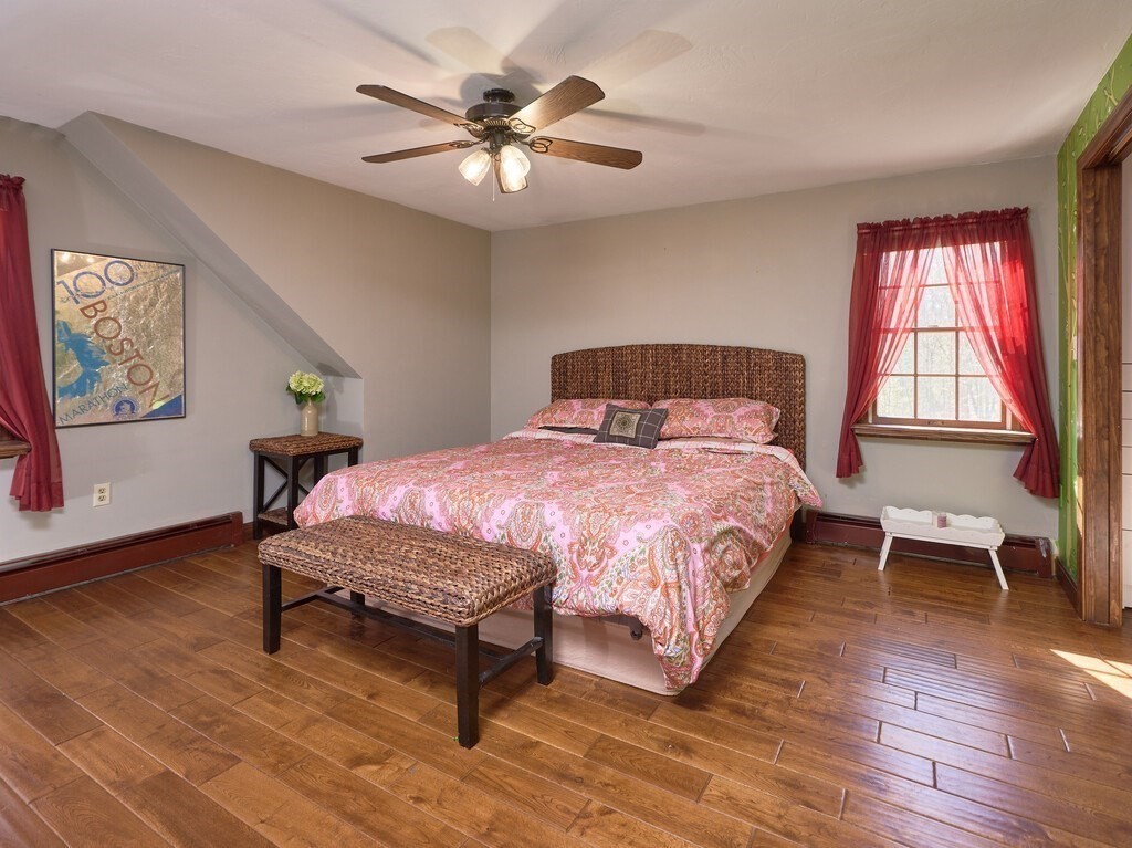 4 Martin Road Brookfield, MA 01506 - Photo 18 of 39 a bedroom with a bed a table and chair