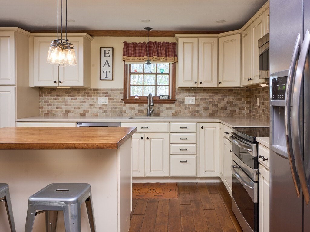 4 Martin Road Brookfield, MA 01506 - Photo 10 of 39 a kitchen with stainless steel appliances a sink stove and cabinets