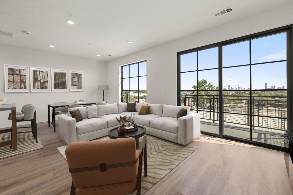 4315 South Congress Avenue, Unit 428 Austin, TX 78745 - Photo 1 of 1 a living room with furniture and a floor to ceiling window