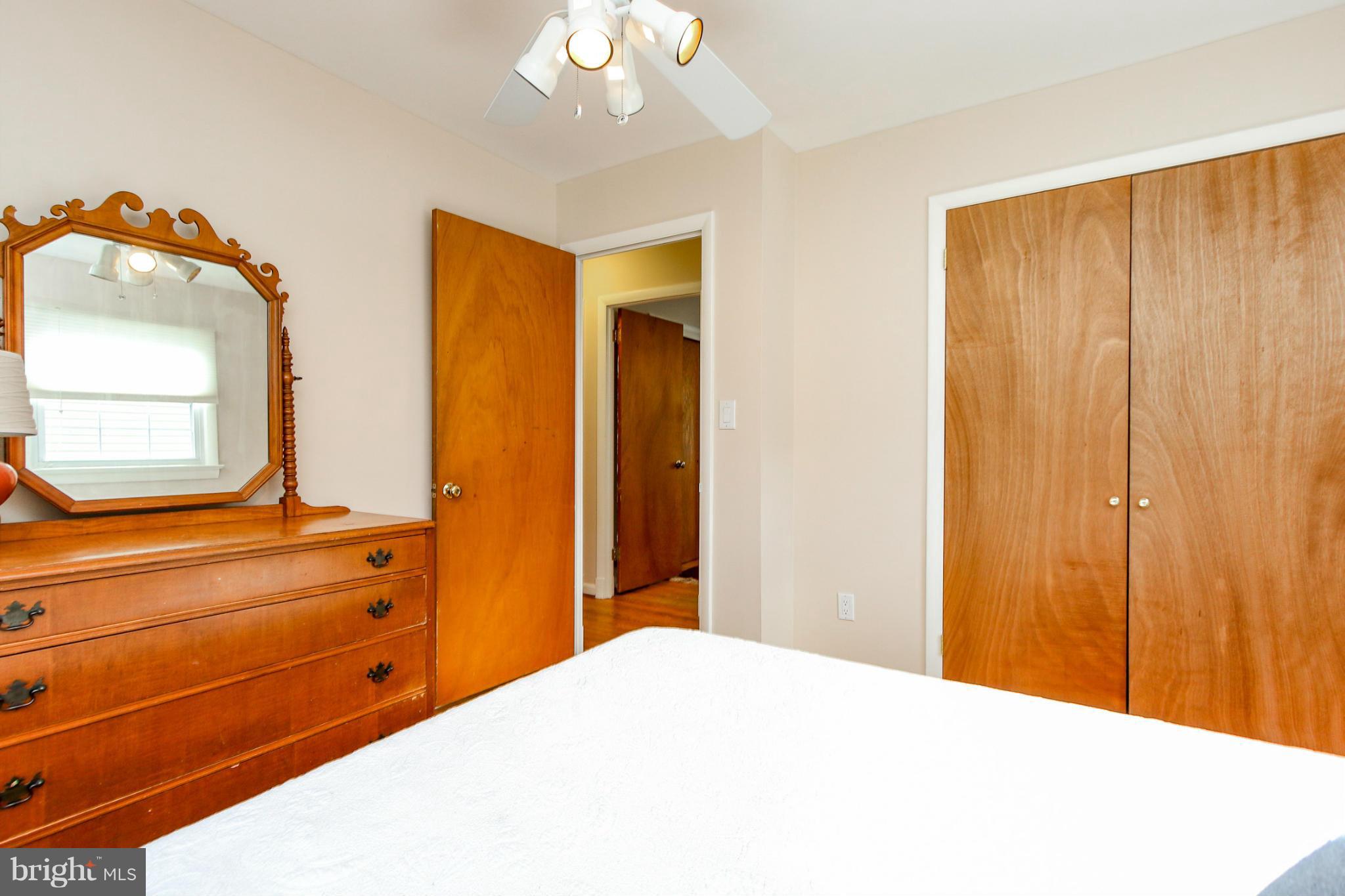 13201 Clifton Road Silver Spring, MD 20904 - Photo 12 of 30 a bedroom with a bed and a dresser