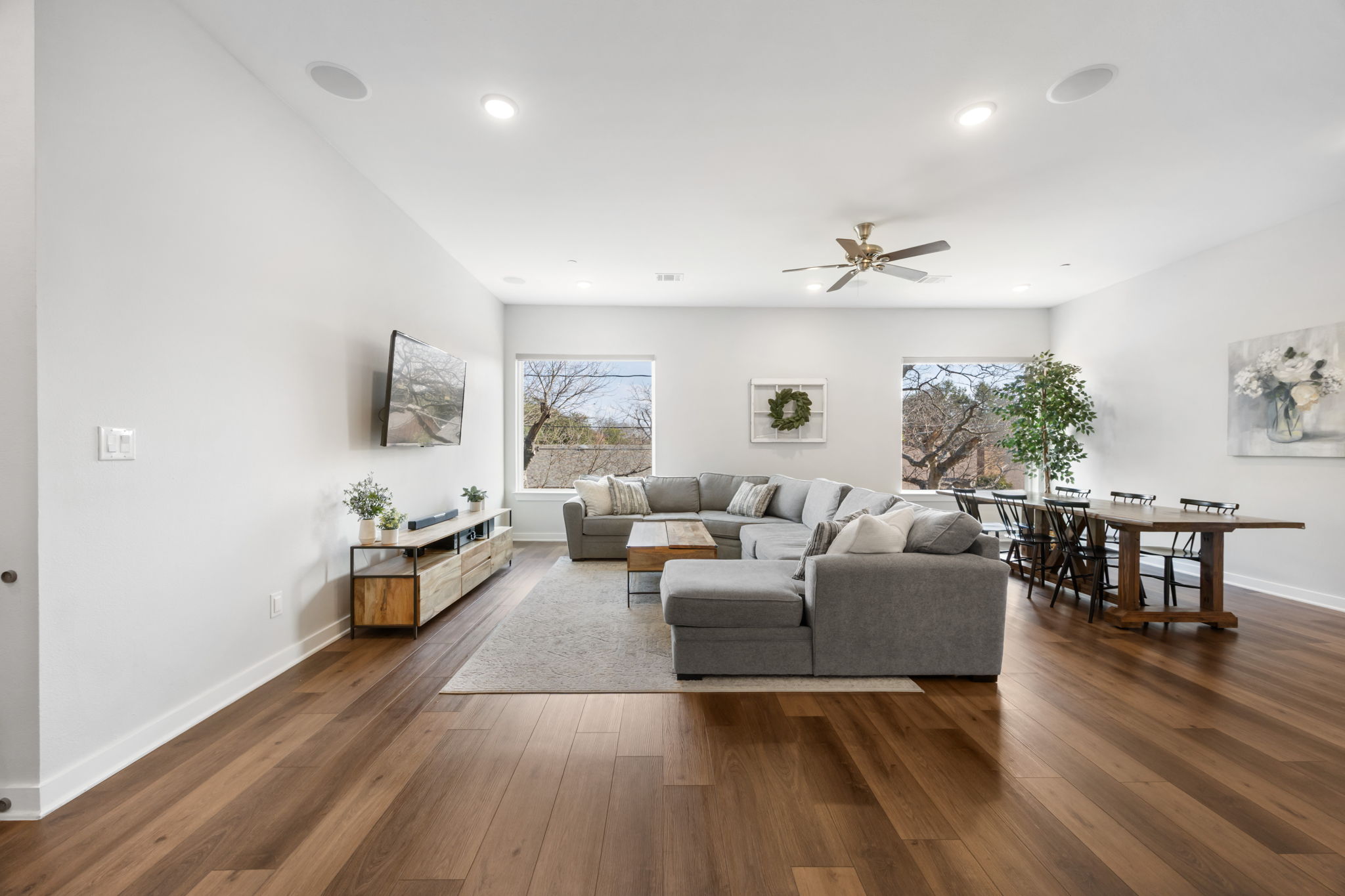 1417 Kramer Lane, Unit 14 Austin, TX 78758 - Photo 7 of 33 Living area with ceiling fan, dark wood-style floors, healthy amount of natural light, and recessed lighting