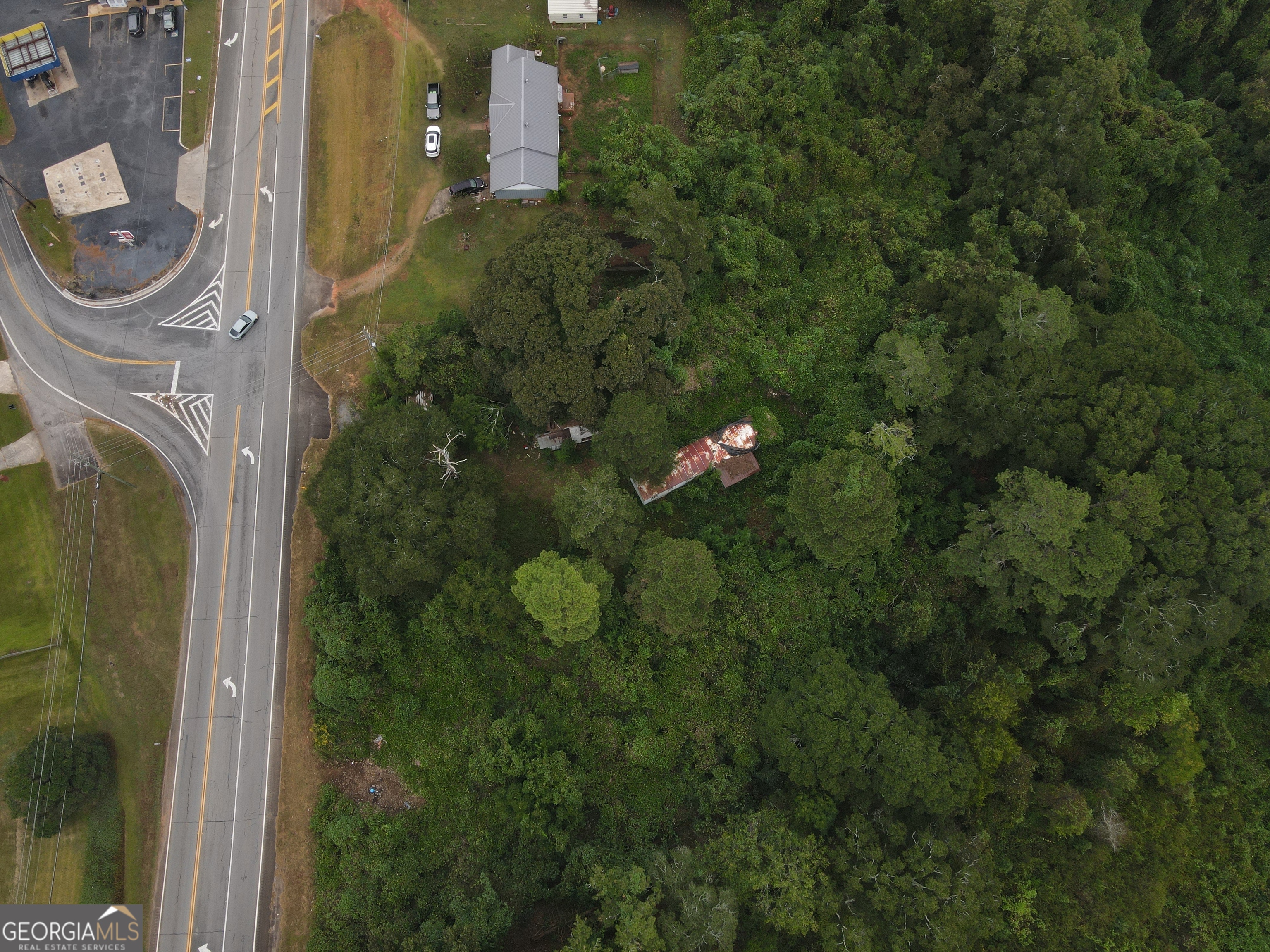 2222 Barnesville Street Thomaston, GA 30286 - Photo 5 of 5 a view of a house with a tree