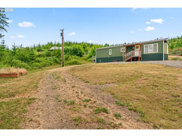 a front view of a house with a yard and a garage