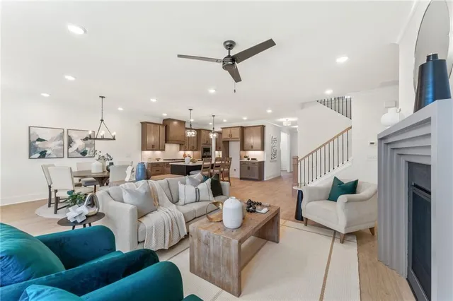 an aerial view of a house with a yard and lake view