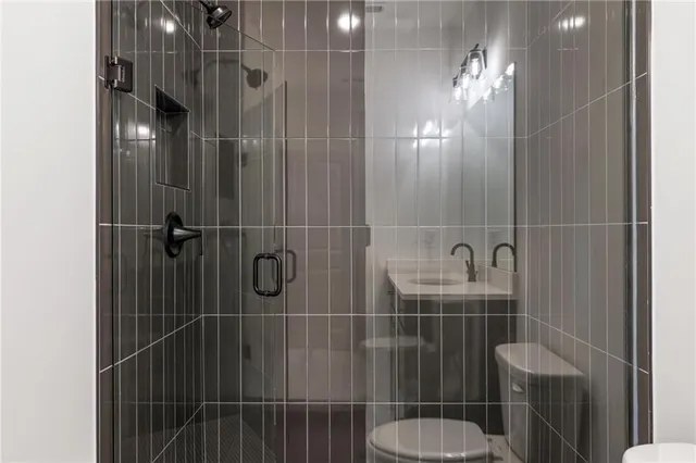 an empty room with a ceiling fan and a window