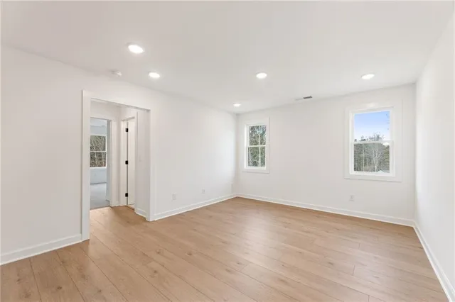 a view of a kitchen with a sink and a refrigerator