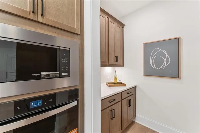 a large kitchen with a table and chairs