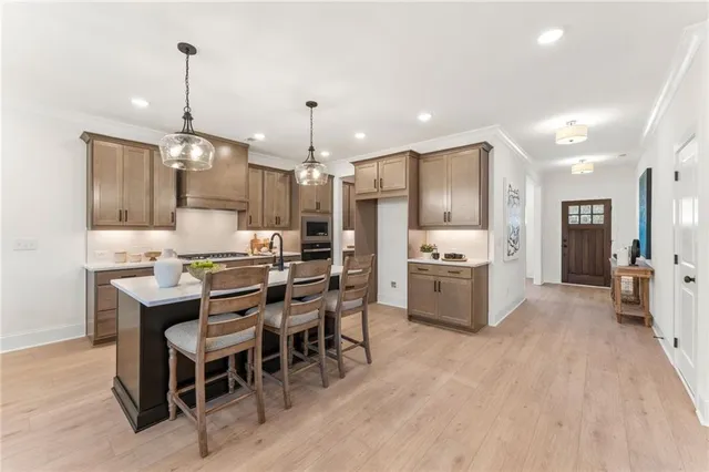 a dining room with furniture a fireplace and wooden floor