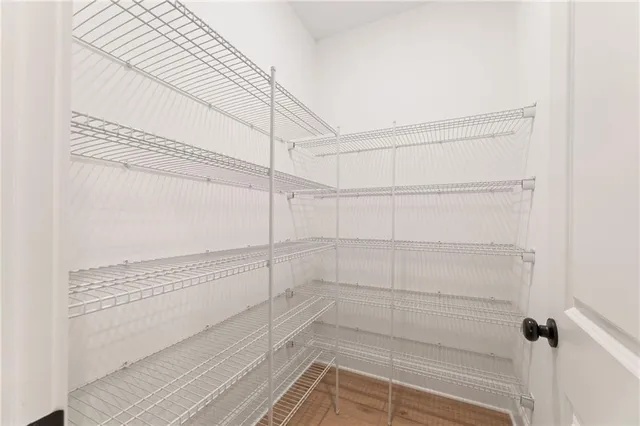 a living room with furniture a fireplace and a window