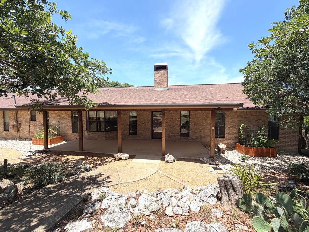 707 Rimrock Road Kerrville, TX 78028 - Photo 53 of 55 a front view of a house with a yard