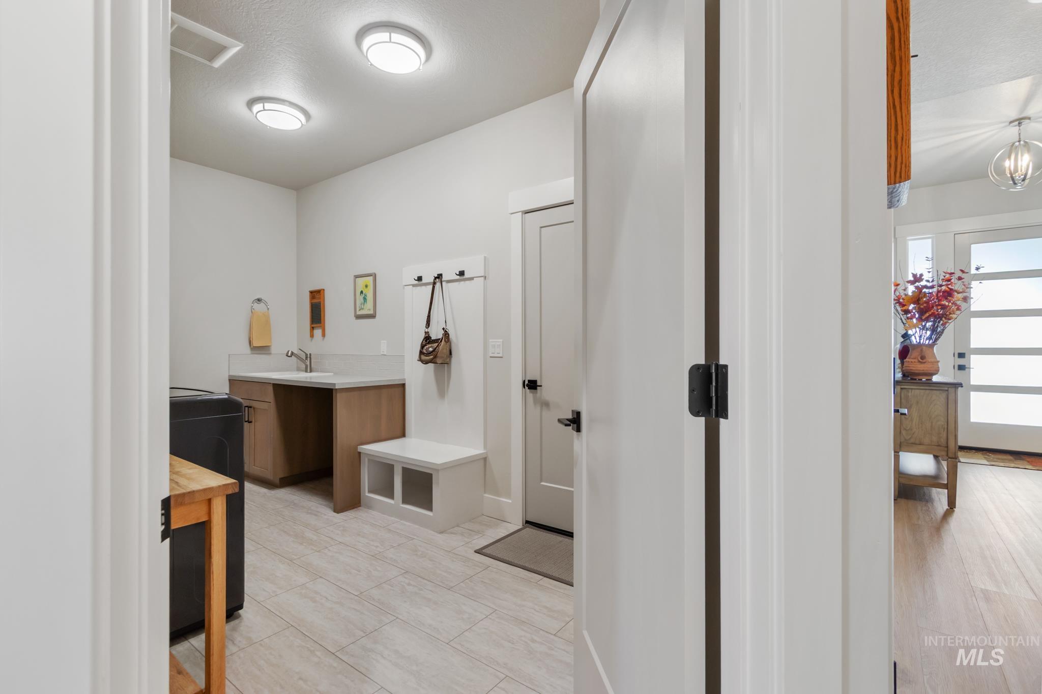9864 West Aviara Street Star, ID 83669 - Photo 11 of 40 Bathroom with vanity and washer / clothes dryer