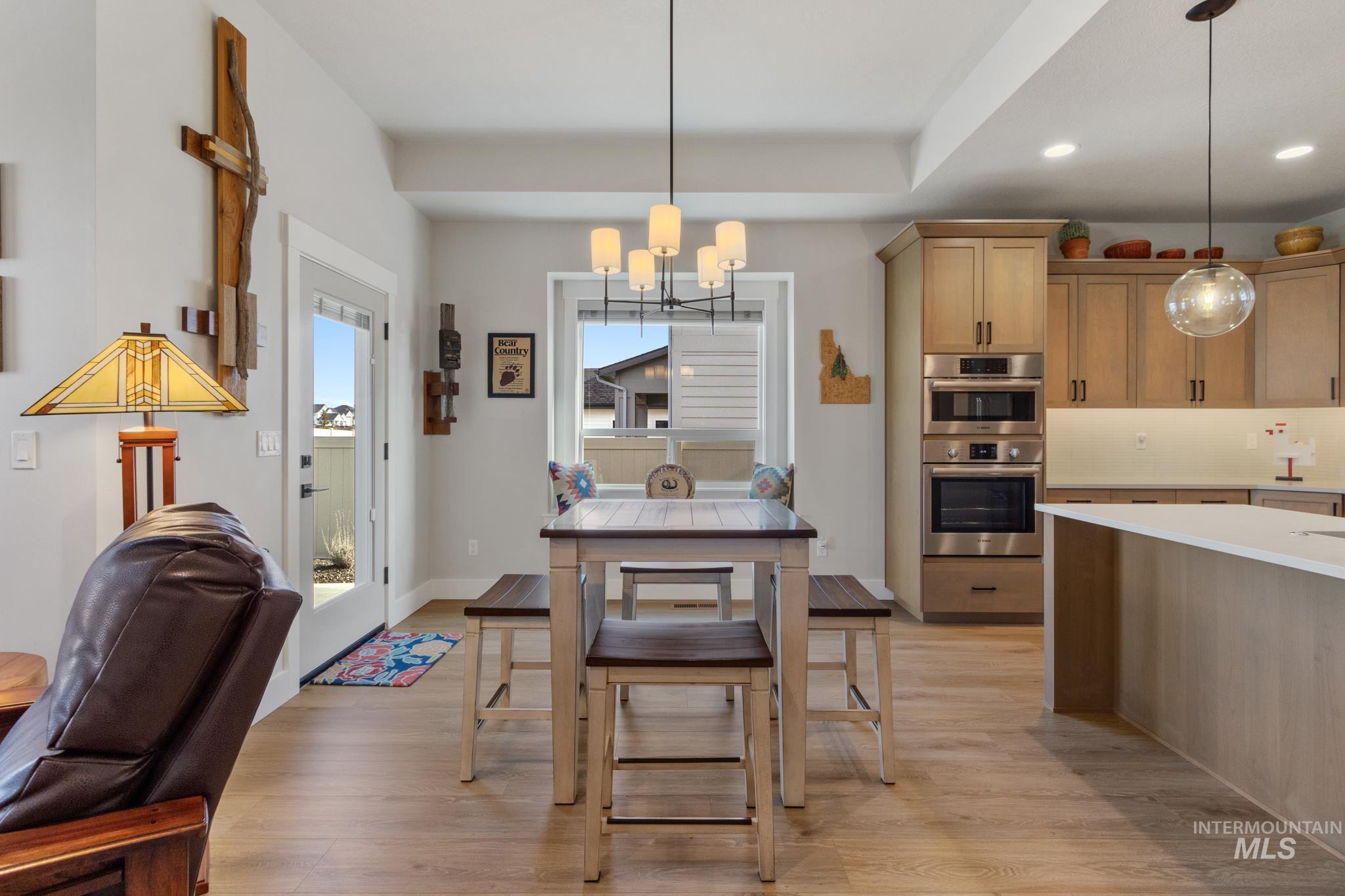 9864 West Aviara Street Star, ID 83669 - Photo 19 of 40 Dining space with suspended lighting and light wood-style flooring