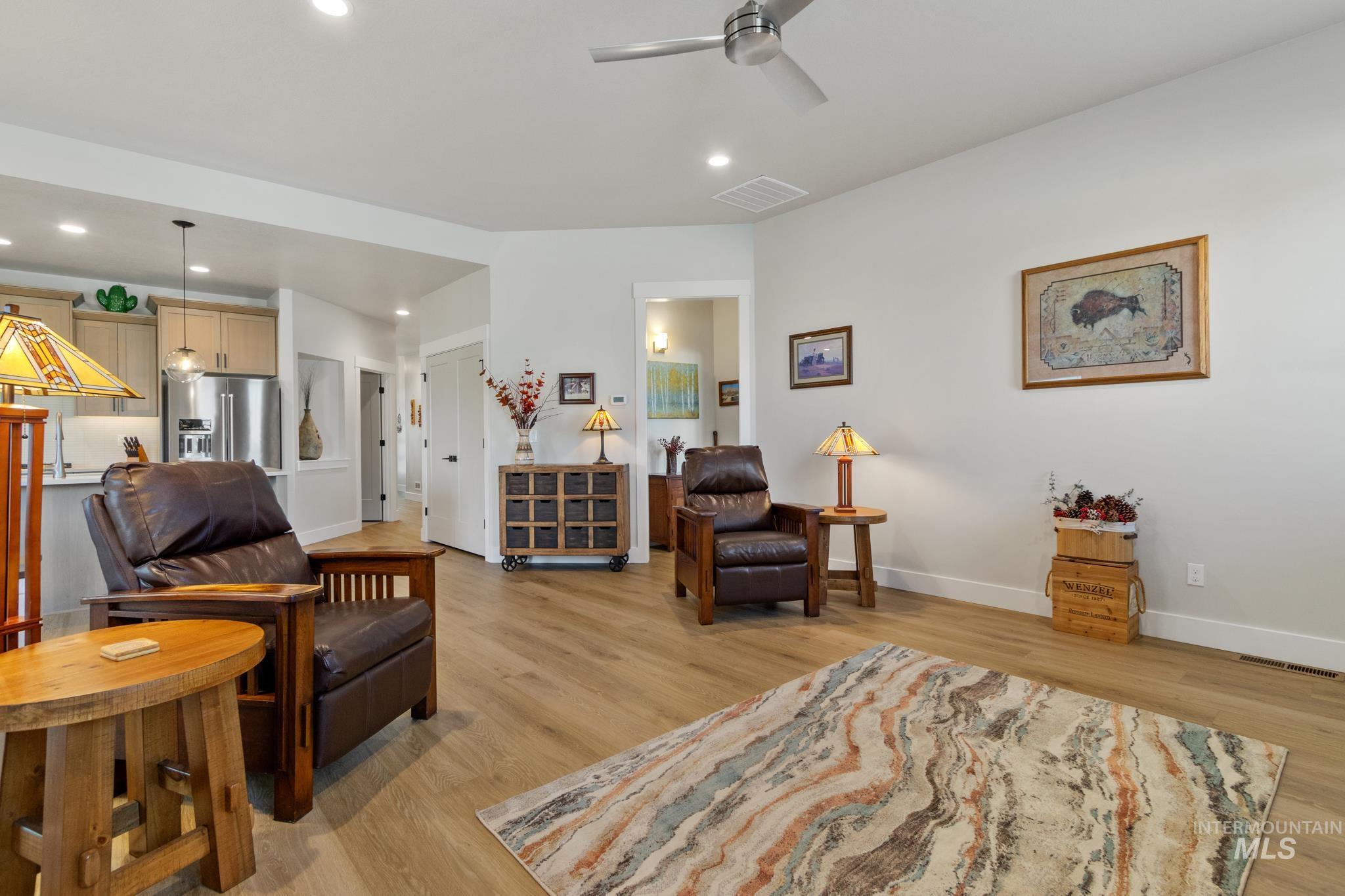 9864 West Aviara Street Star, ID 83669 - Photo 23 of 40 Living room with light wood-type flooring, a ceiling fan, and recessed lighting