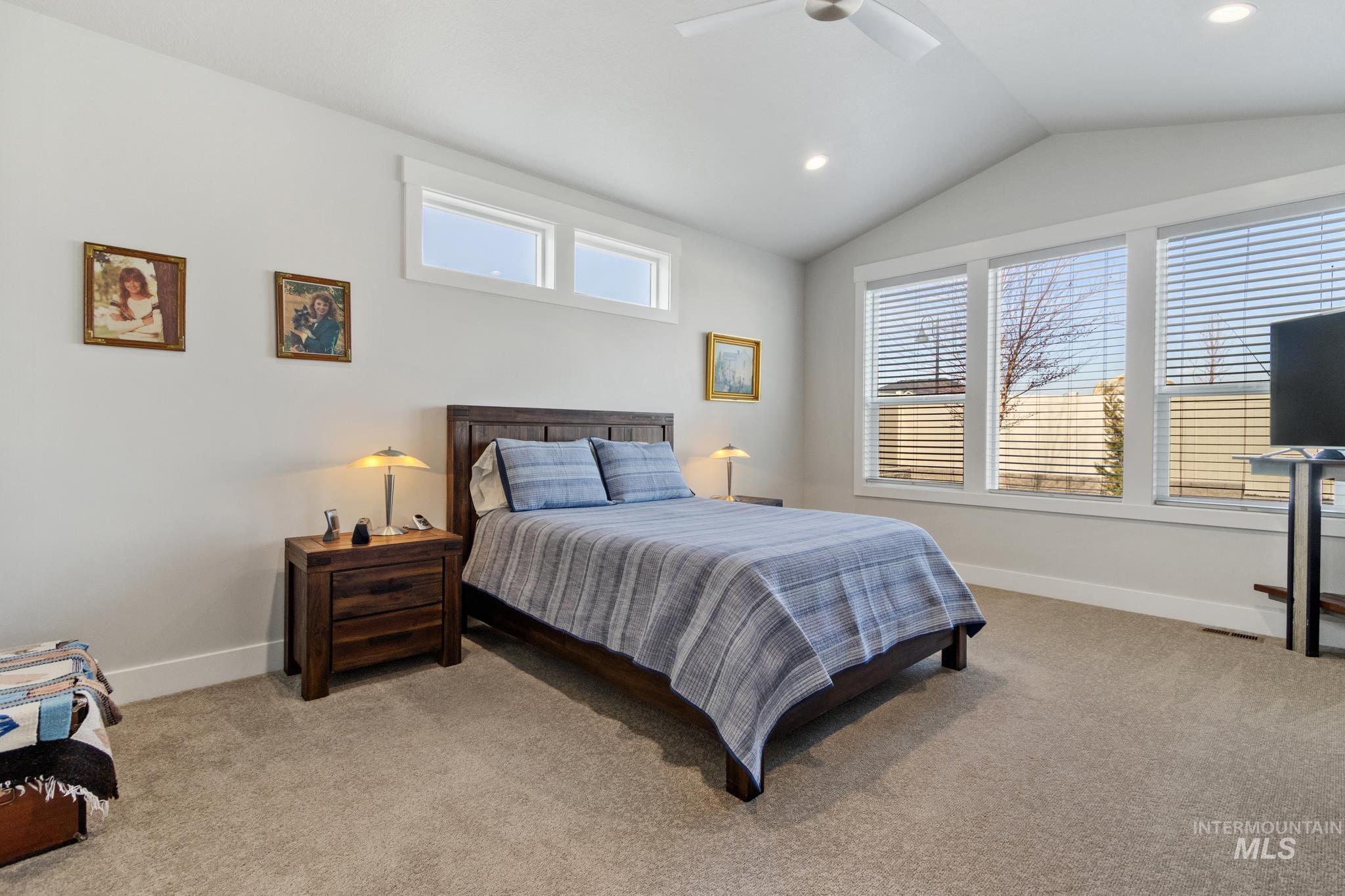 9864 West Aviara Street Star, ID 83669 - Photo 26 of 40 Bedroom featuring multiple windows, light colored carpet, ceiling fan, and recessed lighting