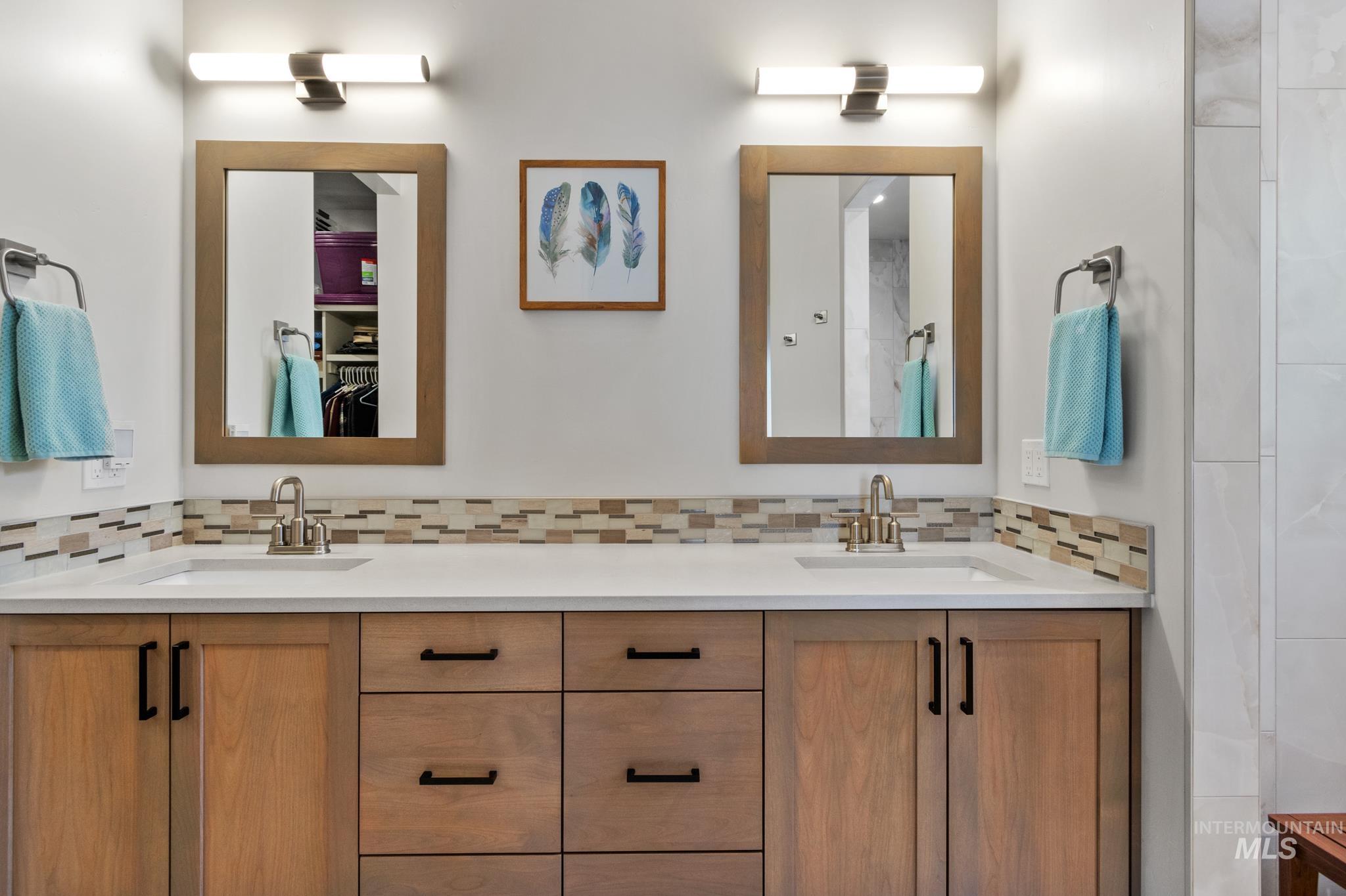 9864 West Aviara Street Star, ID 83669 - Photo 28 of 40 Full bath with double vanity, a walk in closet, and backsplash
