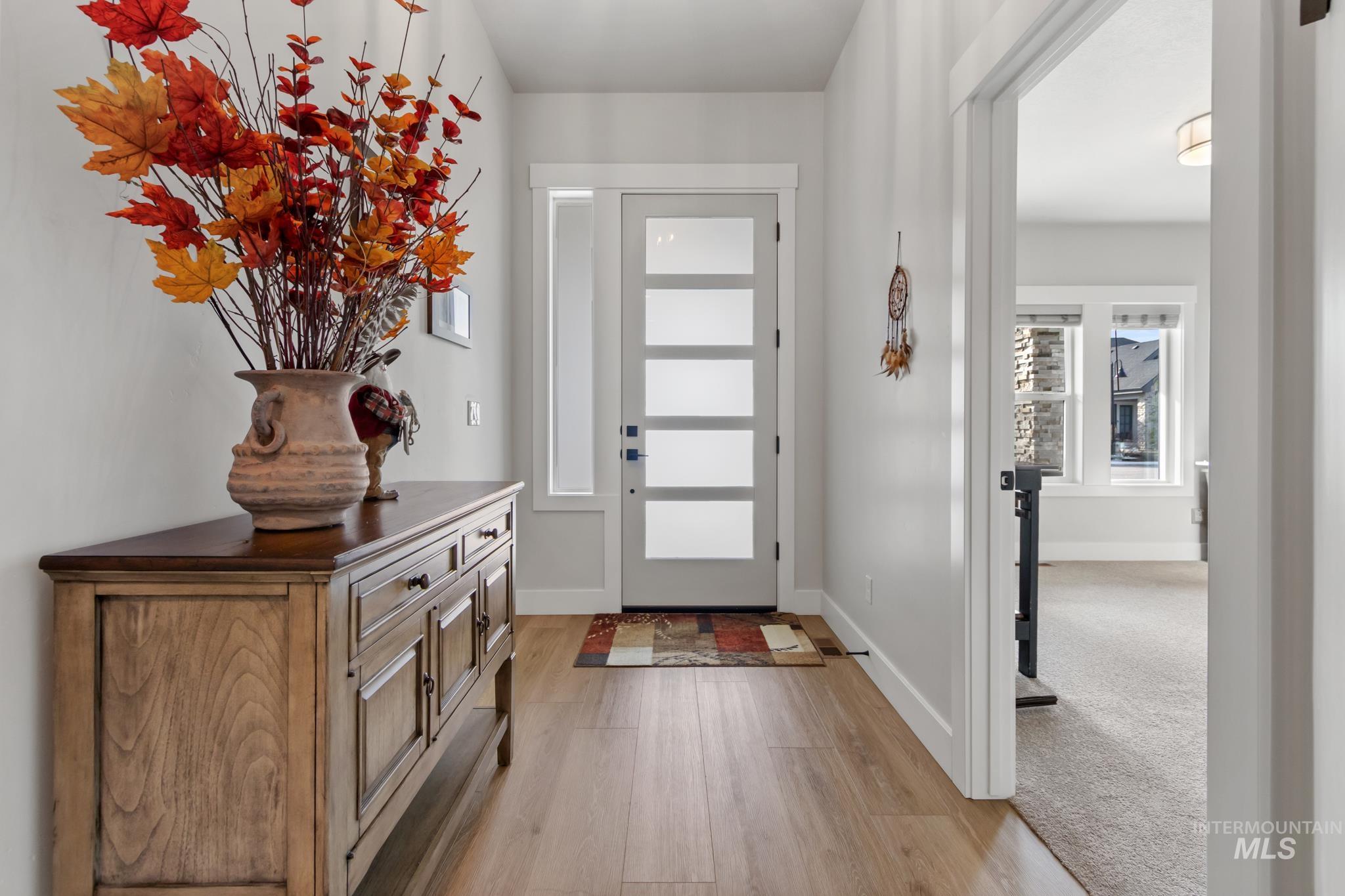 9864 West Aviara Street Star, ID 83669 - Photo 3 of 40 Foyer featuring light wood finished floors and baseboards