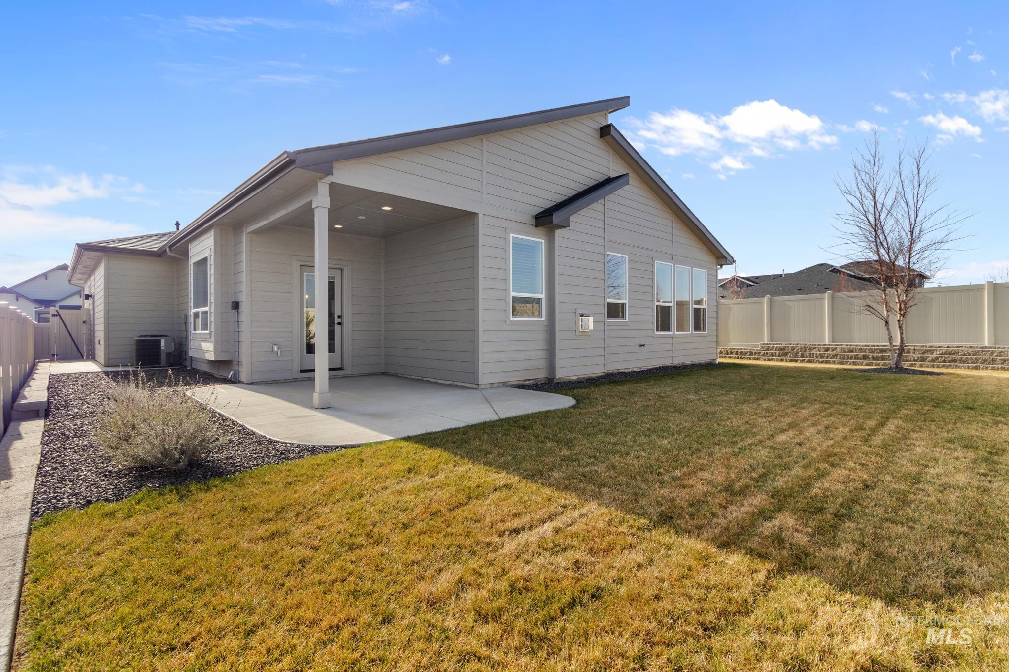 9864 West Aviara Street Star, ID 83669 - Photo 33 of 40 Rear view of property with a fenced backyard and a patio area